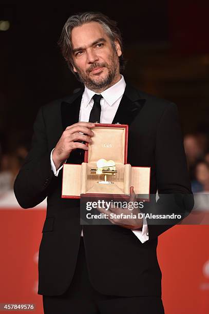 Andrea Di Stefano poses with the Gala Jury Award at the Award Winners Red Carpet during the 9th Rome Film Festival at Auditorium Parco Della Musica...