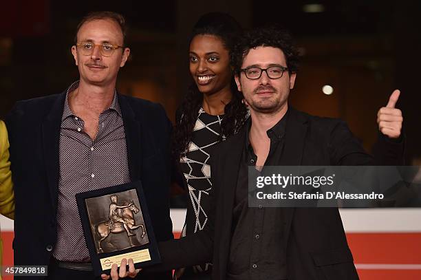 Guest, Yordanos Lulu Beherane and Francesco Raganato pose with the Peoples Choice Award during the Award Winners Photocall during the 9th Rome Film...