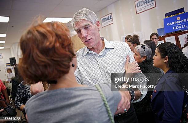 Senator Mark Udall thanks a volunteer at a canvass kickoff campaigns on October 25, 2014 in Thornton, Colorado. Udall is seeking reelection as one of...