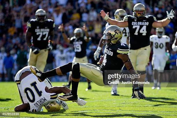 Wide receiver Bryce Bobo of the Colorado Buffaloes falls into the end zone after making a catch and beating defensive back Fabian Moreau of the UCLA...