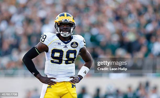 Quarterback Devin Gardner of the Michigan Wolverines reacts after turning the ball over in the third quarter of the game against the Michigan State...