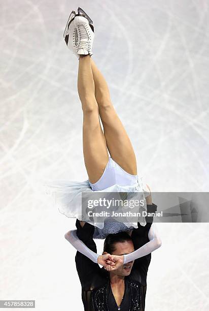 Yuko Kavaguti and Alexander Smirnov compete in the Pairs Short Program during the 2014 Hilton HHonors Skate America competition at the Sears Centre...