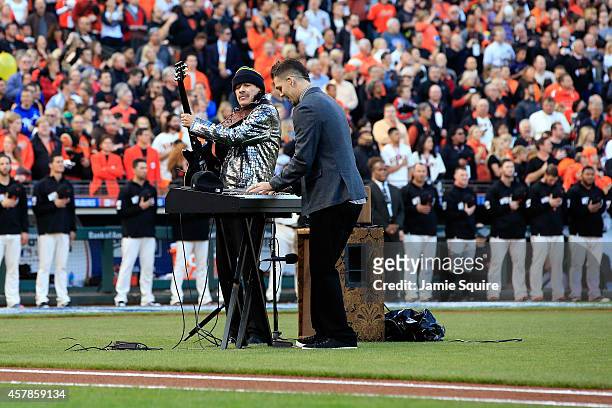 Musician Carlos Santana and son Salvador Santana perform the national anthem before Game Four of the 2014 World Series at AT&T Park on October 25,...