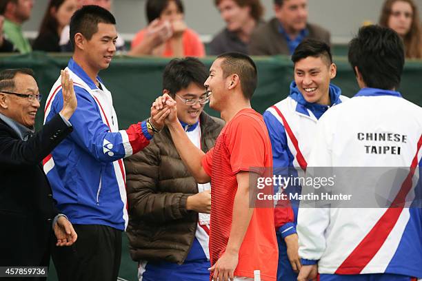 Tsung-Hua Yang of Chinese Taipaei celebrates with teammates after his match against Artem Sitak of New Zealand during day three of the Davis Cup...