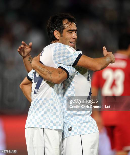 Cesar Delgado of CF Monterrey is congratulated by team-mate Humberto Suazo after scoring his side's fifth goal during the FIFA Club World Cup 5th...