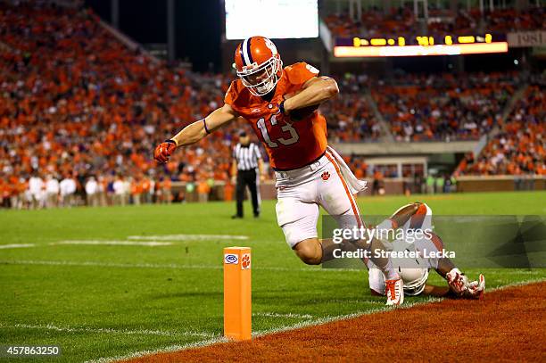 Durell Eskridge of the Syracuse Orange dives after Adam Humphries of the Clemson Tigers who is called out of bounds on a touchdown in the third...