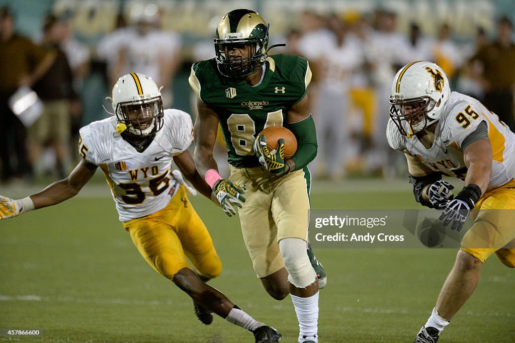 Colorado State Rams wide receiver Xavier Williams, center, eludes ...