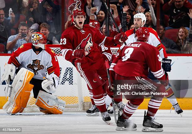 Oliver Ekman-Larsson of the Arizona Coyotes reacts after scoring the game winning overtime goal past goaltender Roberto Luongo of the Florida...