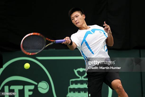 Jui-Chen Hung of Chinese Taipaei in action against Marcus Daniell of New Zealand during day three of the Davis Cup during the Davis Cup tie between...