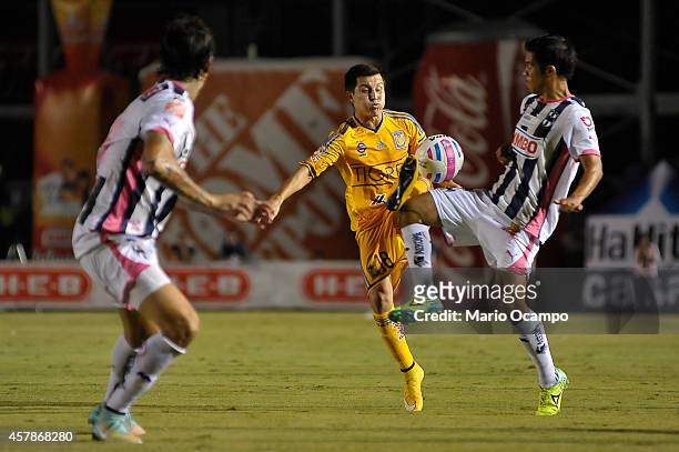 Francisco Torres of Tigres and Severo Meza of Monterrey fight for the ball during a match between Monterrey and Tigres UANL as part of 14th round...