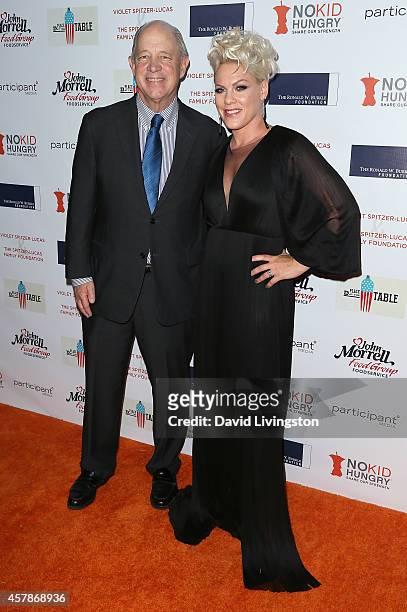 Share Our Strength founder & CEO Billy Shore and singer Pink attend the Share Our Strength's No Kid Hungry Campaign fundraising dinner at Ron...