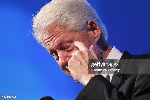 Former U.S. President Bill Clinton sheds a tear during his speech at the 18th Annual HRC National Dinner at The Walter E. Washington Convention...