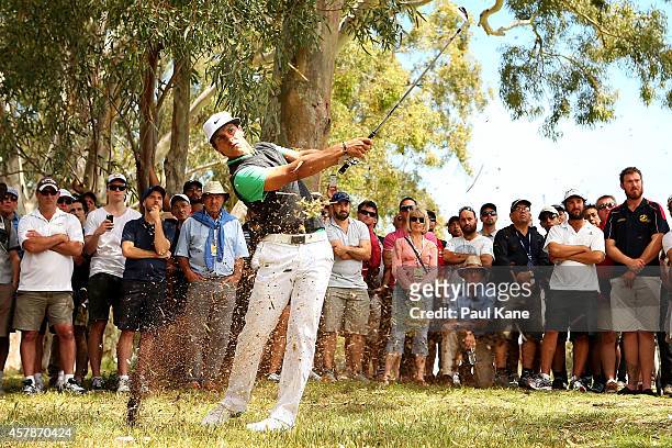 Thorbjorn Olesen of Denmark plays out of the rough on the 7th hole during day four of the 2014 Perth International at Lake Karrinyup Country Club on...