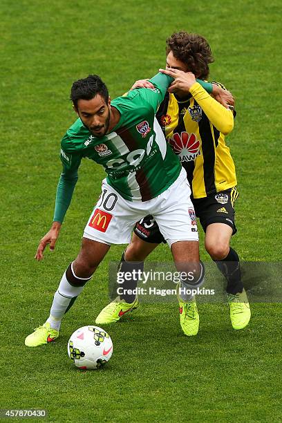 Marcos Flores of the Jets holds off the challenge of Albert Riera of the Phoenix during the round three A-League match between the Wellington Phoenix...