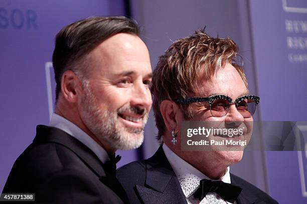 Honorees Sir Elton John and his partner David Furnish arrive at the 18th Annual HRC National Dinner at The Walter E. Washington Convention Center on...