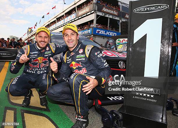 Jamie Whincup and Paul Dumberell drivers for the Red Bull Racing Australia Holden celebrate after winning race 32 for the Gold Coast 600, which is...