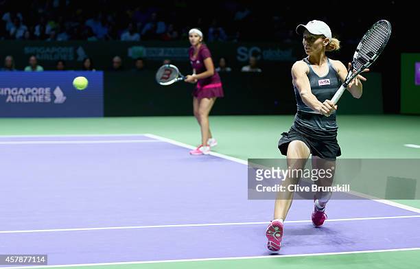 Cara Black of Zimbabwe and Sania Mirza of India in action against Su-Wei Hsieh of Chinese Taipei and Shuai Peng of China in the doubles final during...