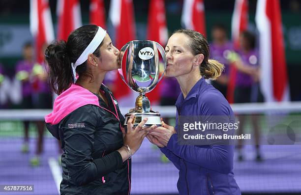 Cara Black of Zimbabwe and Sania Mirza of India kiss the Martina Navratilova Trophy after their straight sets victory against Su-Wei Hsieh of Chinese...
