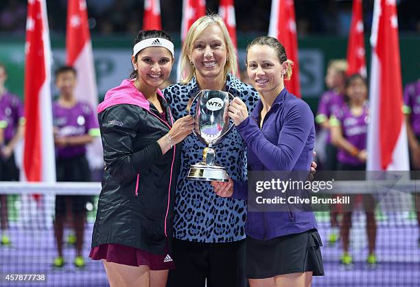 Cara Black of Zimbabwe and Sania Mirza of India pose for a photograph with Martina Navratilova and the Martina Navratilova Trophy after their...