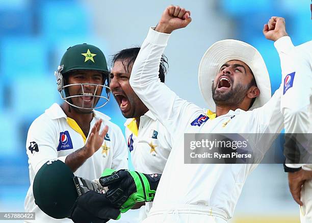 Ahmed Shehzad of Pakistan celebrates after Yasir Shah oand Sarfraz Ahmed of Pakistan claimed the wicket of Mohammad Talha of Pakistan during Day Five...