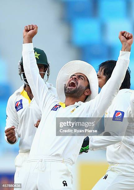 Ahmed Shehzad of Pakistan celebrates after Yasir Shah oand Sarfraz Ahmed of Pakistan claimed the wicket of Mohammad Talha of Pakistan during Day Five...