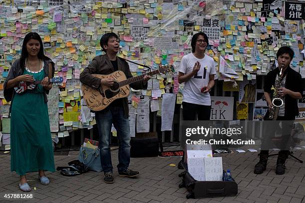 Band entertains pedestrians on a street outside Hong Kong's Government Complex in on October 26, 2014 in Admiralty District, Hong Kong, Hong Kong....