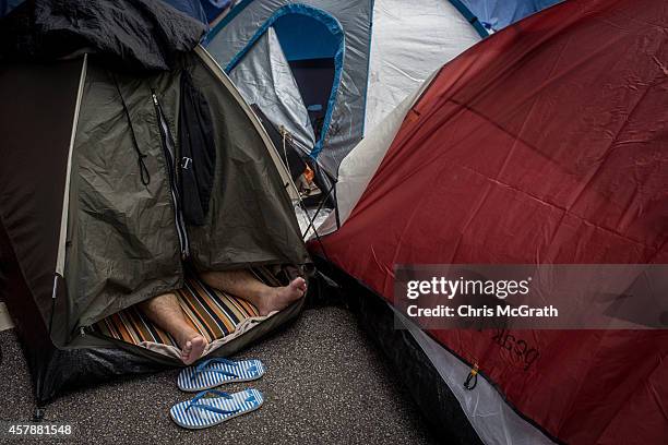 Pro-democracy activist sleeps in a tent on a street outside Hong Kong's Government Complex in on October 26, 2014 in Admiralty District, Hong Kong,...