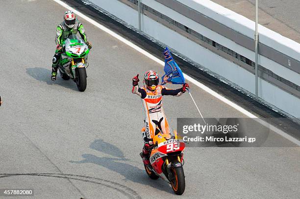 Marc Marquez of Spain and Repsol Honda Team celebrates after winning the MotoGP Of Malaysia - Race at Sepang Circuit on October 26, 2014 in Kuala...