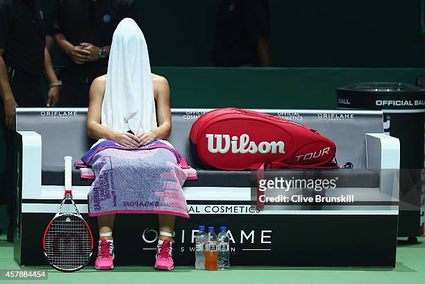 Simona Halep of Romania shows her dejection during the change over against Serena Williams of the United States the final during the BNP Paribas WTA...