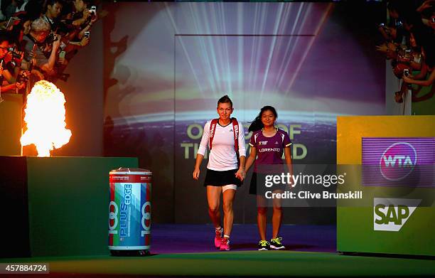 Simona Halep of Romania walks out for her match against Serena Williams of the United States in the final during the BNP Paribas WTA Finals at...