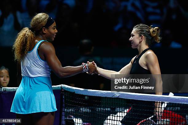 Serena Williams of USA is congratulated by Simona Halep of Romania in the final during day seven of the BNP Paribas WTA Finals tennis at the...