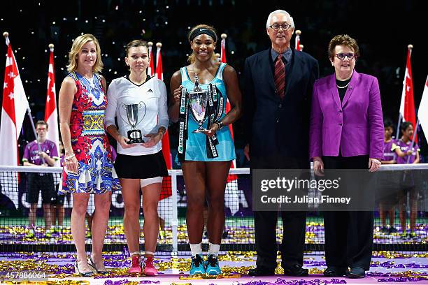Serena Williams of USA with the Billie Jean King trophy next to runner up Simona Halep of Romania, Chris Evert, Billie Jean King and former prime...