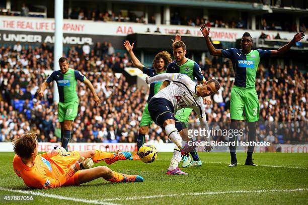 Tim Krul of Newcastle United saves a backheel from Roberto Soldado of Spurs during the Barclays Premier League match between Tottenham Hotspur and...