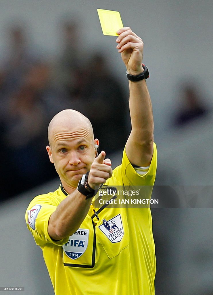 Cards In Football Referee Anthony Taylor shows a yellow card to Newcastle United's ...
