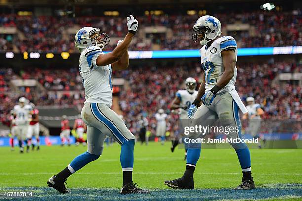 Golden Tate of the Detroit Lions celebrates scoring a touchdown in the third quarter with Jeremy Ross of the Detroit Lions during the NFL match...