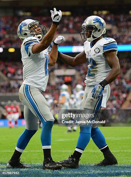 Golden Tate of the Detroit Lions celebrates scoring a touchdown in the third quarter with Jeremy Ross of the Detroit Lions during the NFL match...