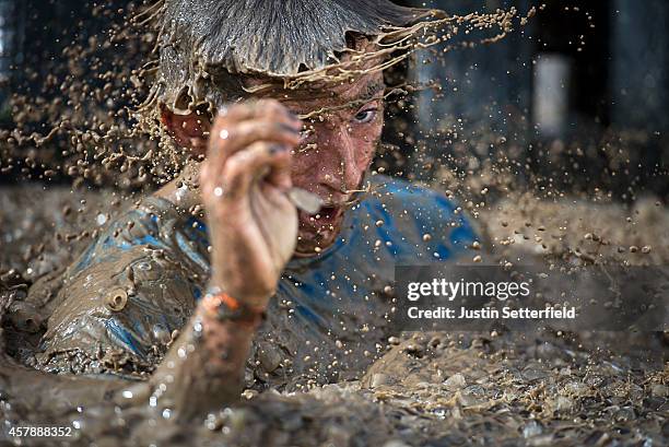 Competitor takes part in the Tough Mudder London South on October 26, 2014 in Winchester, England. The world-famous Tough Mudder is military style...