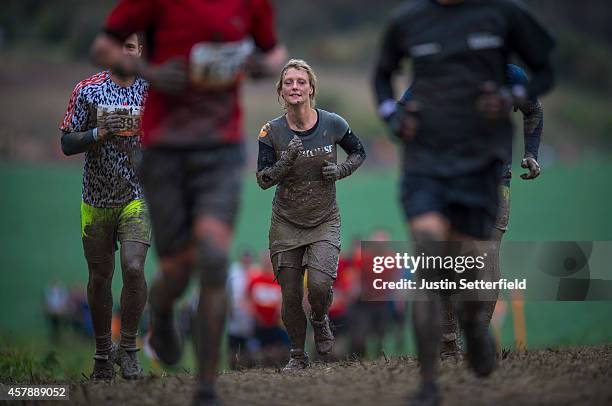 Competitors take part in the Tough Mudder London South on October 26, 2014 in Winchester, England. The world-famous Tough Mudder is military style...