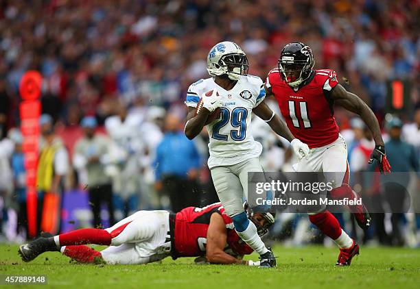 Cassius Vaughn of the Detroit Lions looks to break away from Julio Jones of the Atlanta Falcons during the NFL match between Detroit Lions and...