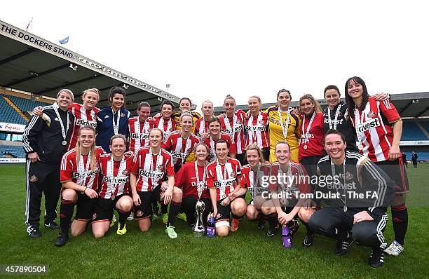 Sunderland Ladies team pose with the trophy during the FA WSL 2 match between Millwall Ladies and Sunderland Ladies at The Den on October 26, 2014 in...