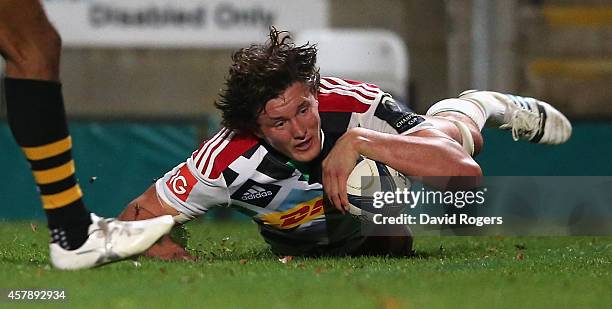 Charlie Matthews of Harlequins dives over for a try during the European Rugby Champions Cup match between Wasps and Harlequins at Adams Park on...