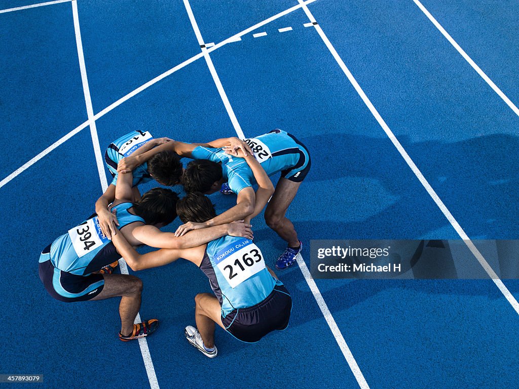 Athletes making a circle