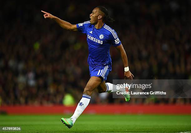 Didier Drogba of Chelsea celebrates scoring the first goal during the Barclays Premier League match between Manchester United and Chelsea at Old...