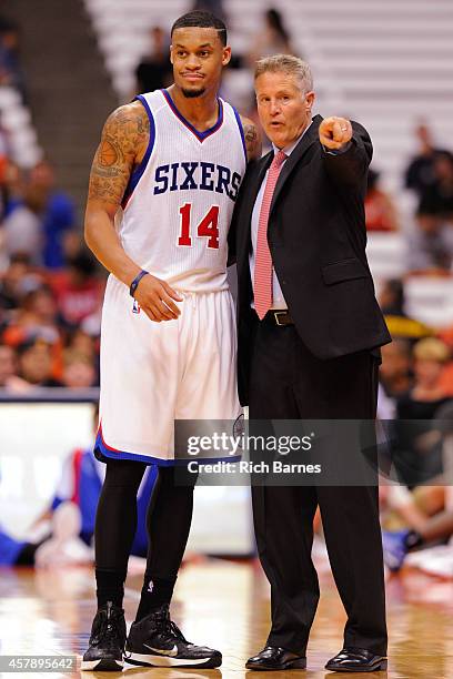 McDaniels and Brett Brown of the Philadelphia 76ers talk during a preseason game against the New York Knicks at the Carrier Dome on October 14, 2014...