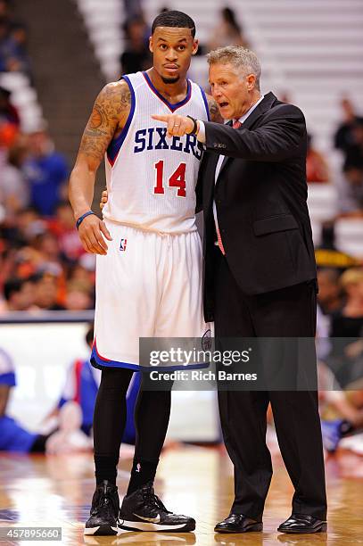 McDaniels and Brett Brown of the Philadelphia 76ers talk during a preseason game against the New York Knicks at the Carrier Dome on October 14, 2014...