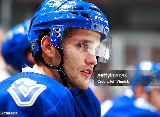 Linden Vey of the Vancouver Canucks looks on from the bench during their NHL game against the Tampa Bay Lightning at Rogers Arena October 18, 2014 in...