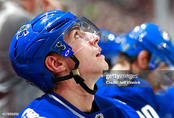 Alexandre Burrows of the Vancouver Canucks looks on from the bench during their NHL game against theTampa Bay Lightning at Rogers Arena October 18,...