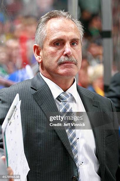 Head coach Willie Desjardins of the Vancouver Canucks looks on from the bench looks on from the bench during their NHL game against theTampa Bay...