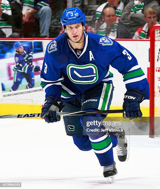 Kevin Bieksa of the Vancouver Canucks skates up ice during their NHL game against theTampa Bay Lightning at Rogers Arena October 18, 2014 in...