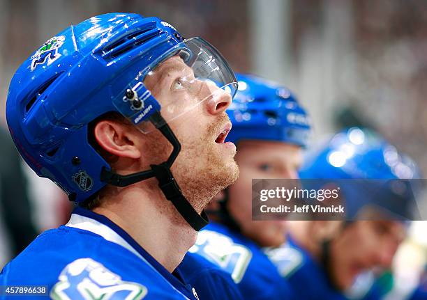 Jannik Hansen of the Vancouver Canucks looks on from the bench during their NHL game against theTampa Bay Lightning at Rogers Arena October 18, 2014...